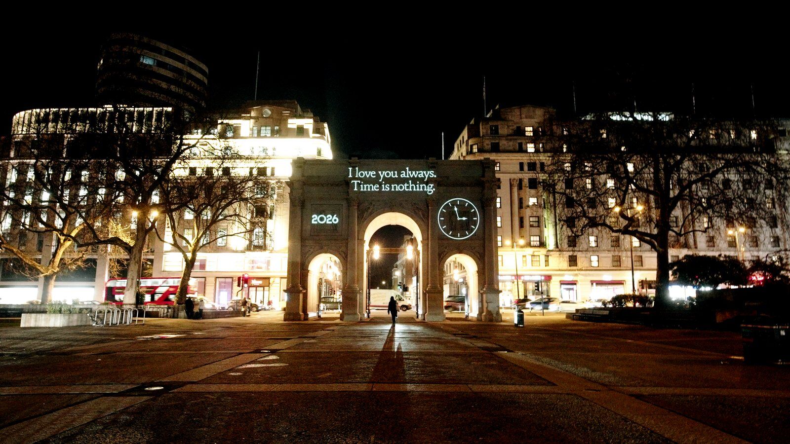 Life Out of Order projection on Marble Arch with backwards clock, London